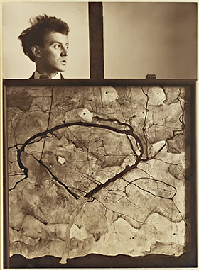 Egon Schiele behind the painting "Autumn Tree in Stirred Air (Winter Tree)", 1912 